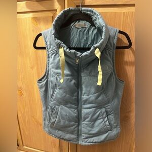 North Face aqua vest and neon yellow detailing